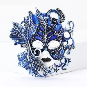 Detailed close-up of a blue enamel Venetian mask brooch with intricate feather design