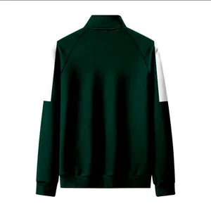 Vue arrière d'une veste de sport pour enfants vert foncé avec col montant et empiècements.