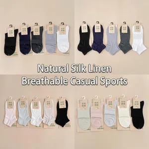 Detailed view of various colorful cotton and linen socks for women with tags