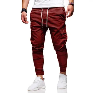 Men's stylish burgundy cargo jogger pants with white drawstring and pocket detail