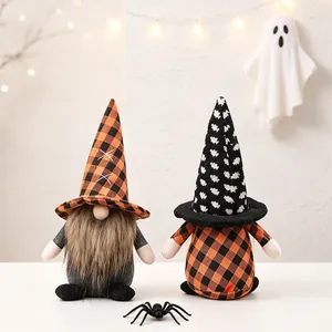 Pair of Halloween plush gnomes with plaid hats and festive spider decoration