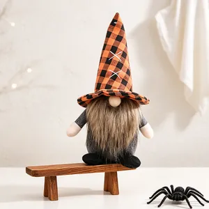 Detailed macro view of Halloween faceless gnome doll with orange and black plaid hat