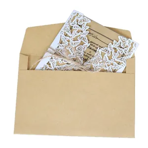 Elegant laser-cut white butterfly invitation card set with kraft envelope and twine