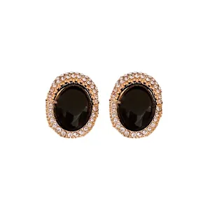 Vintage oval stud earrings with black stone and sparkling rhinestones in gold finish