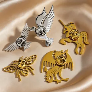 Detailed macro view of stainless steel animal brooches with secure butterfly clutches