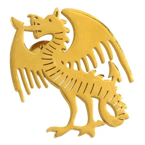 Detailed macro shot of golden dragon brooch showing hollowed wings and metallic texture