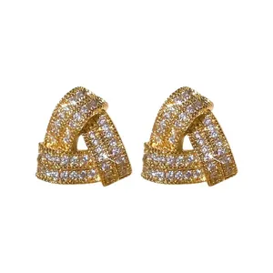 Elegant gold-finished interlocking triangle stud earrings with sparkling cubic zirconia