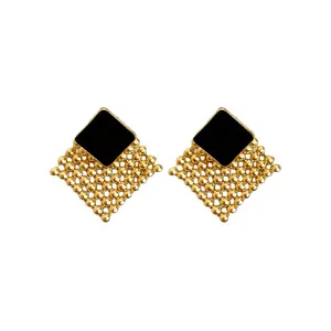 Vintage gold woven diamond stud earrings with black enamel square and silver needle