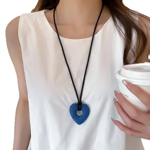 Elegant blue heart pendant long necklace on black cord for stylish women's daily wear