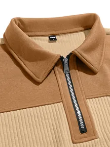 Close-up of men's quarter-zip fleece sweatshirt featuring a ribbed color block design.