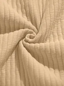 Macro view of beige ribbed knit fabric texture for men's fleece sweatshirt