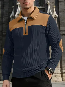 Macro view of men's navy and tan color-block half-zip sweatshirt with collar detail.