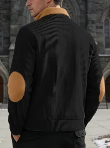 Close-up of a men's black ribbed sweatshirt with tan elbow patches and a stand collar