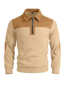 Detail view of tan ribbed half-zip sweatshirt with brown contrast shoulder patches.