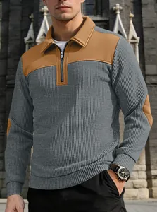 Detailed view of men's ribbed half-zip sweatshirt with stylish color-block design