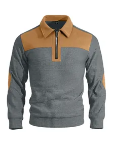 Detailed close-up of grey ribbed men's quarter-zip sweatshirt with brown accents