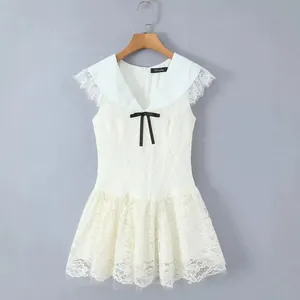 Elegant French white lace V-neck mini dress with black bow and mesh skirt detailing