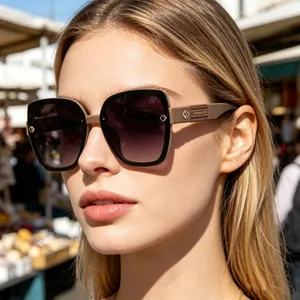 Close-up of stylish large-frame polarized sunglasses with gradient lenses for women