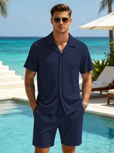 Detailed view of men's navy blue resort wear set featuring a textured button-down shirt.