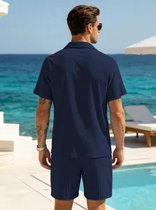 Back view of men's dark blue textured short sleeve shirt and shorts resort set
