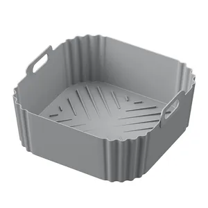 Detailed view of grey square silicone air fryer liner with handles and wavy side walls