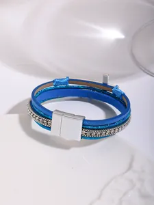 Detailed view of bohemian blue multi-layer leather bracelet with rhinestone accents