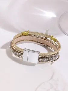 Detailed view of Bohemian multi-layer leather bracelet with cross charm and magnetic clasp