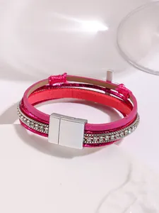 Detailed macro view of hot pink multi-layer PU leather bracelet with sparkly rhinestones