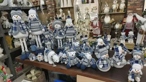 Collection of blue and white plaid Christmas plush dolls and festive ornaments