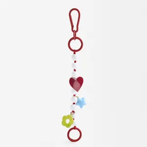Stylish handmade colorful bead bag charm featuring red heart star and flower pendants