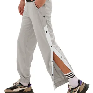 Men's grey full snap-button track pants, loose joggers perfect for basketball training