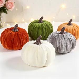 Set of 5 soft velvet decorative pumpkins for Halloween and Thanksgiving decor.