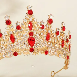 Luxury gold bridal crown with red rhinestones and sparkling crystal embellishments