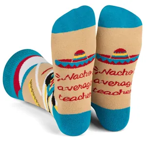Close-up of Nacho Average Teacher pun and sombrero graphic on colorful cotton socks sole