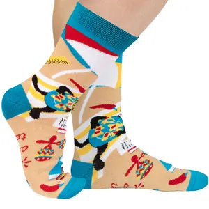 Close-up detail of colorful Mexican theme cotton socks with chili and maraca patterns.