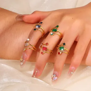 Detailed view of elegant gold stainless steel rings with vibrant colorful gemstones