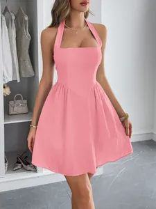 Elegant pink halter neck mini dress with square neckline and flared skirt detail.