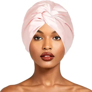 Elegant pink faux silk double-layer sleep cap featuring a stylish twisted knot design