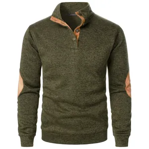 Detailed view of olive green knit pullover with brown elbow patches and stand collar