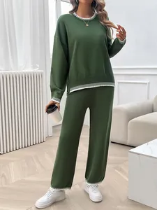 Casual two-piece knit set featuring long-sleeved sweater and wide-leg pants in green.