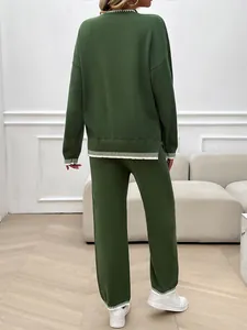 Back view of oversized olive green knit lounge set with contrast striped trim detail