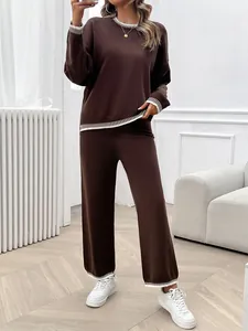 Full view of women's casual brown long-sleeved knit set with striped trim detail
