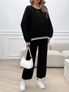 Elegant black loose long-sleeve knit two-piece set with white contrast trim detailing
