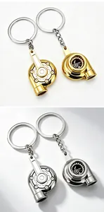 Two metallic car turbocharger-shaped keychains in gold and silver finishes
