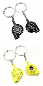 Detailed view of turbocharger keychains in black and yellow for car enthusiasts