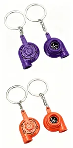 Detail of turbocharger-shaped car tuning keychains in vibrant purple and orange colors.