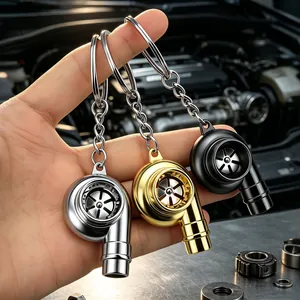 Three metallic turbocharger keychains in silver, gold, and black car engine theme