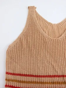 Macro detail of women's lightweight knitted tank top with contrast stripe hem