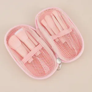 Comprehensive pink 10-piece mini makeup brush set organized in a matching zippered pouch