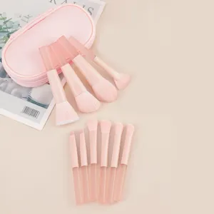 10pcs pink makeup brush set with transparent handles and matching travel storage pouch